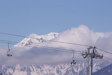 Chairlift in the winter mountains
