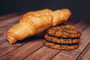 croissants and biscuits on a wooden table