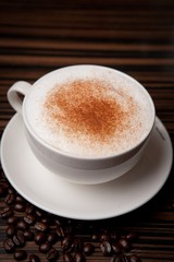 A cup of cappuccino on coffee beans, 카푸치노