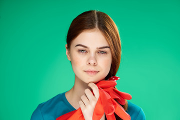 woman with red gloves on a green background