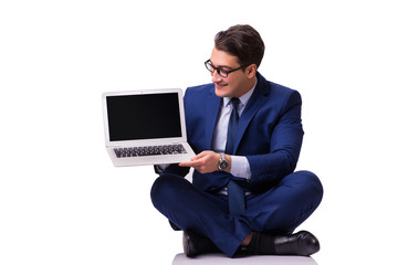 Businessman sitting on the floor isolated on white