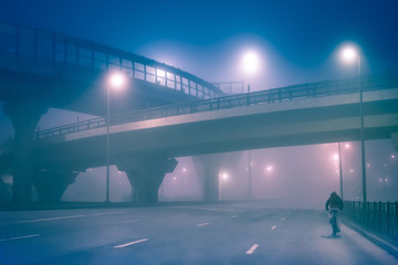 An empty road. Road with a bicyclist.