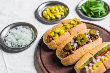 Selection of classic hot dogs against white background