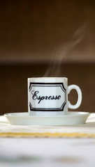 steaming cup of espresso coffee
