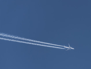 Airplane on blue sky with white cloud