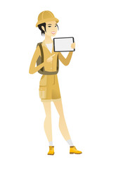 Smiling traveler holding tablet computer.