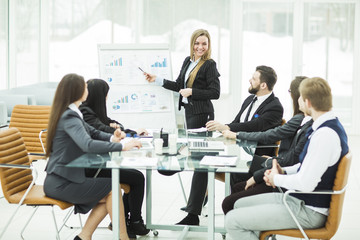  business team gives a presentation of a new financial project for the business partners of the...