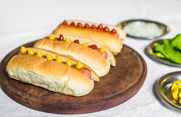 Selection of classic hot dogs against white background