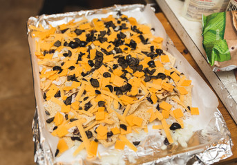 Chips, Cheese, and Olives for Nachos