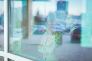 successful business team stands in front of a window in a modern office