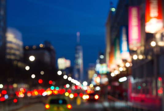 Blurred night lights of Manhattan street in New York City, NYC