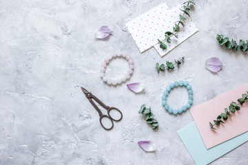 gift preparation with cards and envelopes on gray background top view mock-up