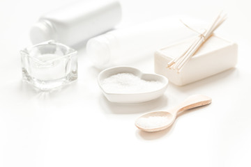 white set of cosmetics for spa on table background