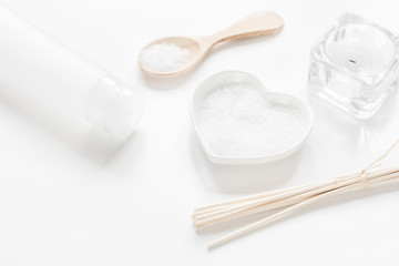 white set of cosmetics for spa on table background