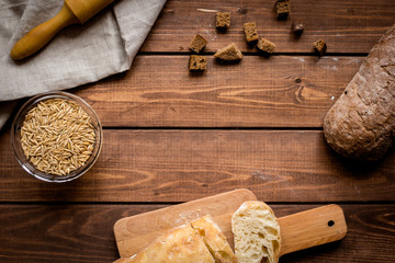 bakery concept with homemade bread on rustic background top view moke-up