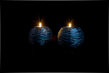  Candlestick with candle on black background 