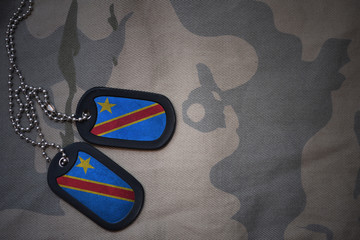 army blank, dog tag with flag of democratic republic of the congo on the khaki texture background. military concept