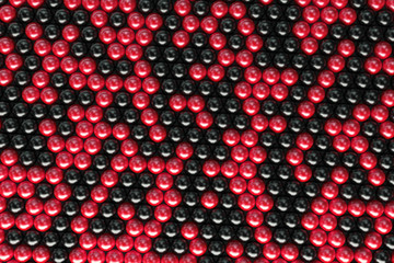 Pattern of black and red spheres