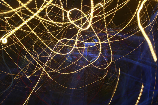 Abstract colored lines in darkness