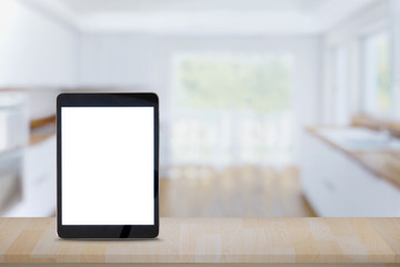 Tablet Showing blank screen on wood table in modern kitchen room. for product and graphic  display montage.