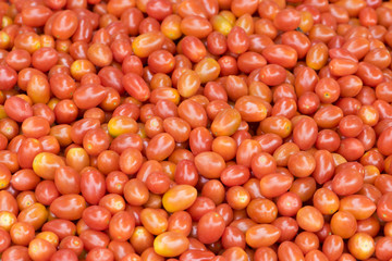 background with fresh red tomatoes in market