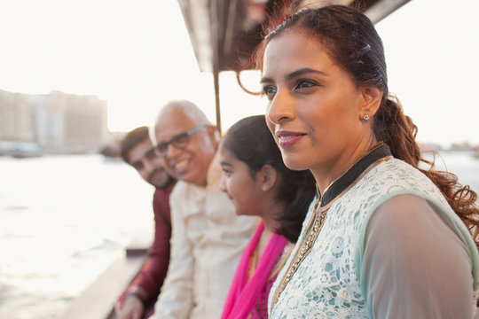 Family traveling on boat at Dubai Creek.