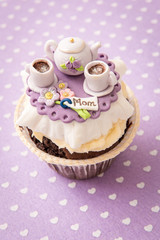 Cupcake with sugar kettle and cups. The concept of mother's day