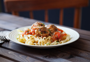 Homemade sauce and meatballs with pasta.