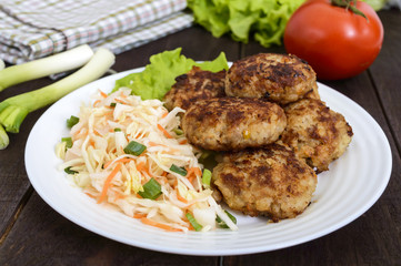 Hamburgers with juicy cutlet, tomatoes, pickled cabbage and cucumbers, cheese, green lettuce leaves and a soft bun with sesame