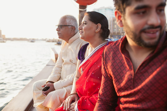 Family traveling on boat at Dubai Creek.