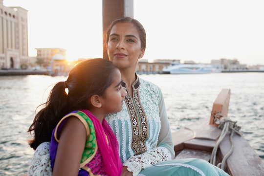 Mother and daughter traveling on boat at Dubai Creek