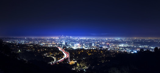 Los Angeles city skyline and highway 101 viewed from West Hollywood hills or heights