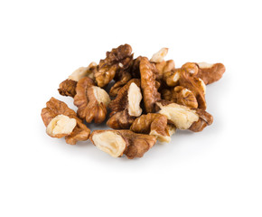 Pile of peeled walnuts close-up isolated on white background