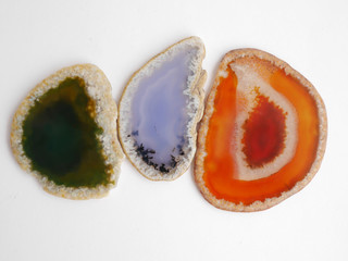 Texture of natural stone. Colorful slices of agate on a white background.