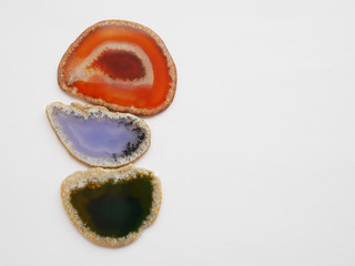 Texture of natural stone. Colorful slices of agate on a white background.