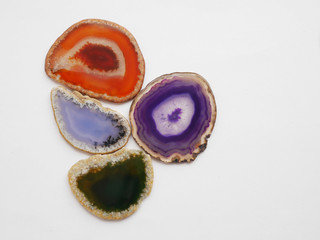 Texture of natural stone. Colorful slices of agate on a white background.