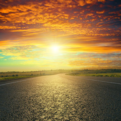 red sunset over asphalt road