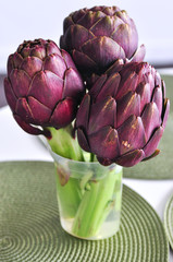 Fototapeta premium Purple artichokes on a table