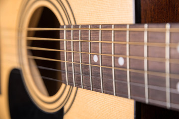 Wooden acoustic guitar isolated with a large horizontal plan