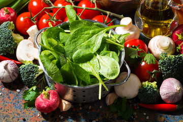 fresh organic vegetables and spices on a dark background