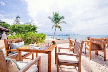 Fototapeta na wymiar Table setting. Resort cafe on the tropical sea beach with beautiful view.