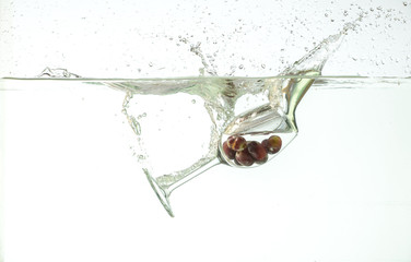 glass splashing into water