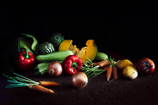 Fototapeta Collection of fresh vegetables on dark rustic background. Healthy eating concept. Vegan dinner