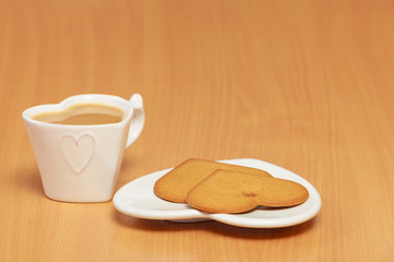 Gingerbread cookies and tea coffee on table.