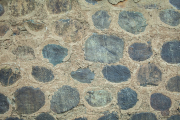 big stone in the cement, rock in wall, boulder background