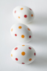Patterned easter eggs on plastered background