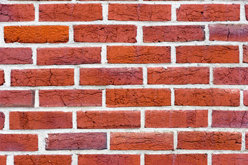 Red bricks in layers as a cladding of a wall
