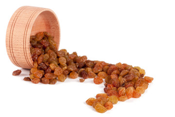 raisins in a wooden bowl isolated on white background