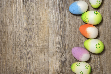 Fototapeta na wymiar Easter eggs on rustic wood