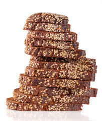 slices of black bread with sesame seeds isolated on white background